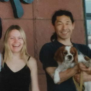 Sghieru Kamimura holding his dog and Nicole Patterson